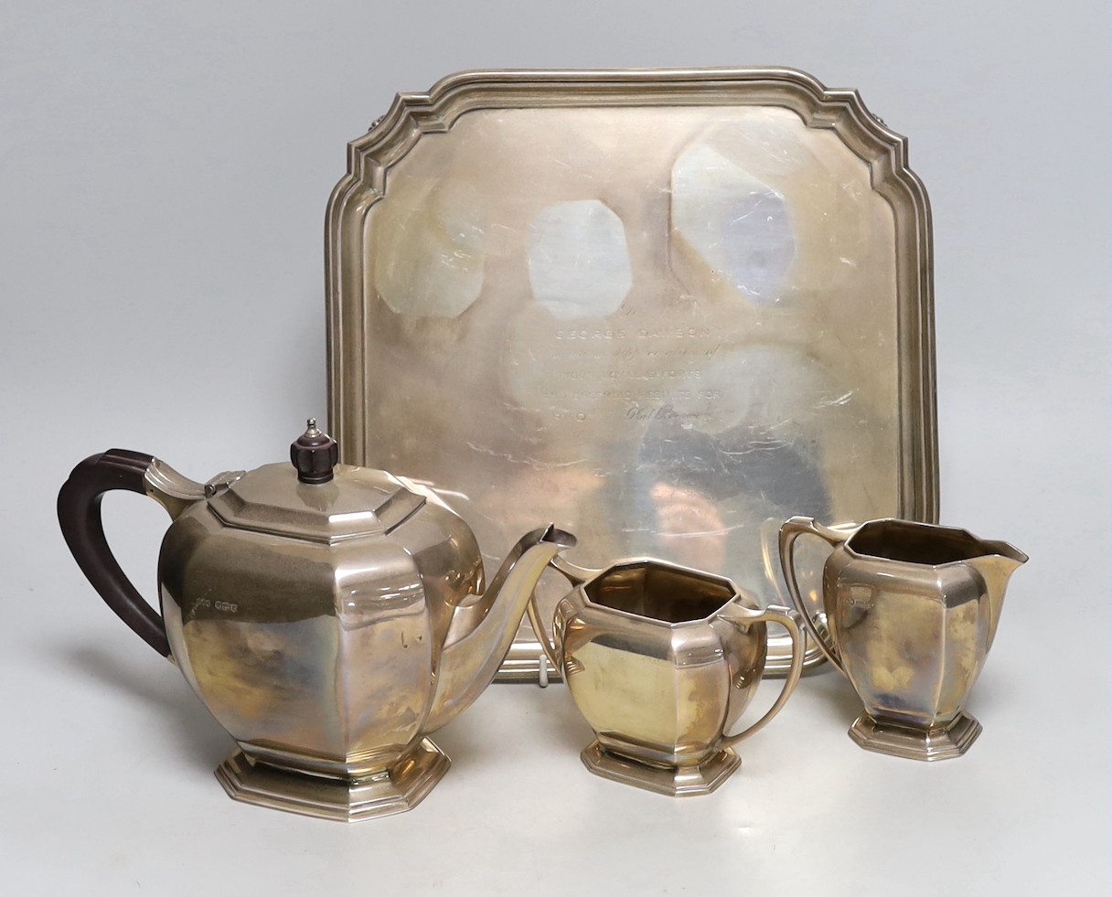 A George VI silver three piece tea set and matching tea tray, E.J.E, Sheffield, 1939, tray with engraved inscription, 30.2cm, gross weight 69.3oz.